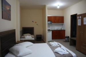 Posteľ alebo postele v izbe v ubytovaní House Stamatis