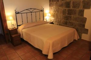 Ένα ή περισσότερα κρεβάτια σε δωμάτιο στο Masia Cal Mas +33 φωτογραφίες