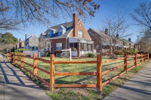 a wooden fence in front of a house at WFH-Friendly Vacation Rental in DC! in Washington