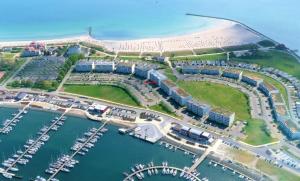 an aerial view of a marina next to a beach at Marina View in Burgtiefe auf Fehmarn 