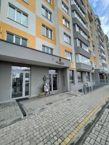 an empty street in front of a building at Апартаменти Underground&SPA in Lviv