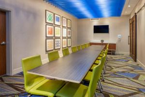 a conference room with a long table and chairs at Holiday Inn Express & Suites Brunswick-Harpers Ferry Area by IHG in Brunswick +82 photos