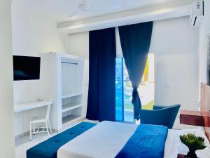 Postel nebo postele na pokoji v ubytování Apart Hotel Paredes