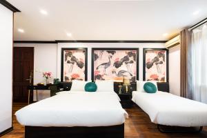 Postel nebo postele na pokoji v ubytování Hanoi Memory Premier Hotel & Spa + 37 fotografií