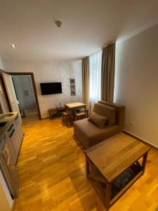 a living room with a couch and a table at Kolakovic in Brzeće