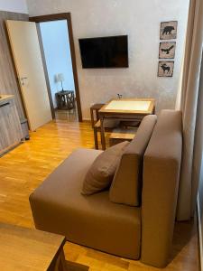a living room with a couch and a table at Kolakovic in Brzeće +2 photos