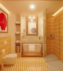 a bathroom with a shower and a toilet and a sink at Hotel Casa Bassa in Valencia