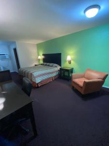 Ένα ή περισσότερα κρεβάτια σε δωμάτιο στο Sunrise Inn