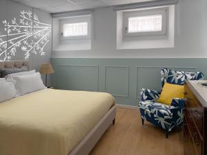 Un pat sau paturi într-o cameră la Armonia della Sera B&B - Residenza di campagna