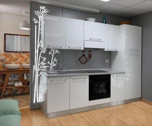 a kitchen with white cabinets and a stove at Armonia della Sera B&B - Residenza di campagna in Porto SantʼElpidio