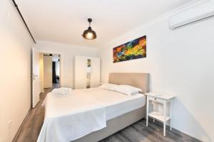 Un ou plusieurs lits dans un hébergement de l'établissement Modern Comfortable Apt at Galata&Istiklal