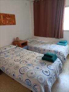 A bed or beds in a room at Las Palmas - Hasta 6 Personas
