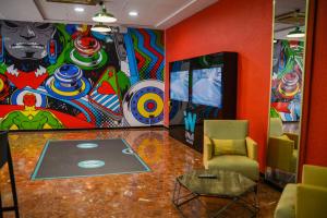 a room with a painting on the wall at Lloret Vibe Affiliated by FERGUS in Lloret de Mar