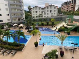 a view of a swimming pool at a resort at Flat 123 - Veredas - 300 metros Hot Park - Vista Piscina in Rio Quente