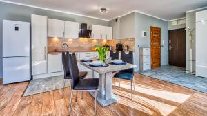 Η κουζίνα ή μικρή κουζίνα στο Apartament H7 z Pięknym Widokiem - 5D Apartments