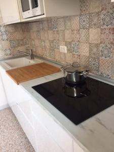 A kitchen or kitchenette at APPARTAMENTO FONTANE DUE Bagni
