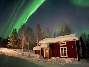 Bogärdan, cozy cabin by the Luleå River v zimě