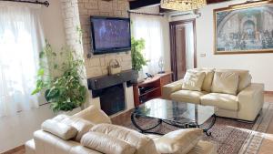 Telewizja i/lub zestaw kina domowego w obiekcie Villa Turrion