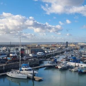 a group of boats docked in a harbor at The Royal Oak Hotel in Ramsgate