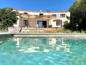 a pool of water in front of a house at Casa Altura in Coti-Chiavari