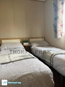 A bed or beds in a room at Caravan Holiday on Haven site