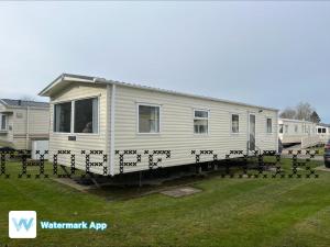 a flock of birds standing around a mobile home at Caravan Holiday on Haven site in Cleethorpes