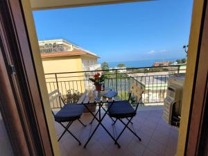 a view of a balcony with a table and chairs at Sara blu apartment in Sorrento