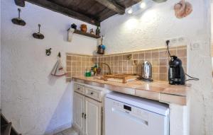 a kitchen with a sink and a counter top at 1 Bedroom Lovely Home In Menton in Menton