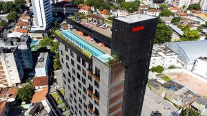 an overhead view of a building with a hilton sign on it at TOLIVE One Housi Recife by Carpediem in Recife