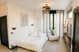 A bed or beds in a room at Apartamento VillaRo