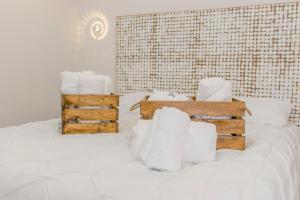 A bed or beds in a room at Apartamento VillaRo
