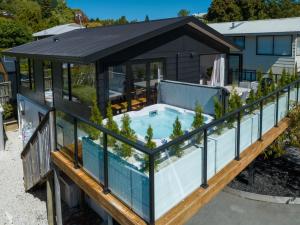 an overhead view of a house with a swimming pool at City Apartments in Nelson