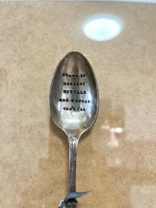 a spoon with words written on the inside of it at Family Apartment 2 Sirmione in Sirmione