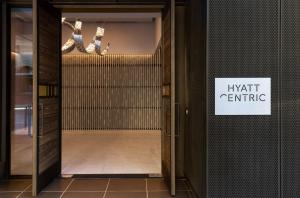 an open door with a sign that reads knight centric at Hyatt Centric Congress Avenue Austin in Austin