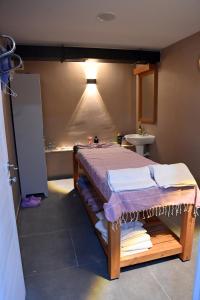 a room with a bed and a sink and a light at Safir Hotels Silivri in Silivri