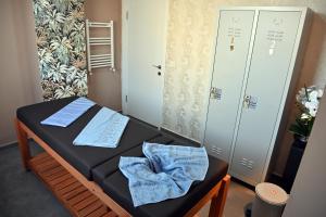 a small room with a bed and two lockers at Safir Hotels Silivri in Silivri