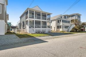 a row of houses in a neighborhood with a street at Town of Bethany Beach - 114 Campbell Place in Bethany Beach