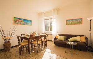 a living room with a table and a couch at La Quiete in Casarza Ligure