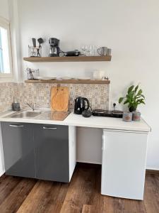 a kitchen with a sink and a counter at Fatolitis Studios in Masouri
