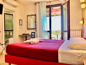 Postel nebo postele na pokoji v ubytování B&B Desenzano Paradise
