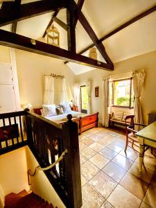 a bedroom with a bed and a table in a room at La Lanterne Chambres d'Hotes in Sarlat-la-Canéda