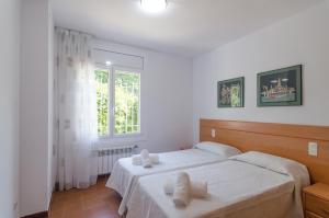 Postel nebo postele na pokoji v ubytování Club Villamar - Briana