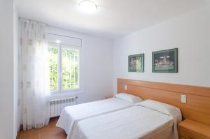 Postel nebo postele na pokoji v ubytování Club Villamar - Briana