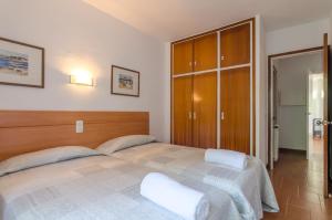 Postel nebo postele na pokoji v ubytování Club Villamar - Briana