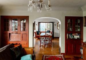 a living room with a couch and a dining room at Beautiful, Historic Family Home near Lake Merritt in Oakland