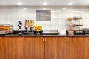 a kitchen with a counter with bananas on it at Home Inn and Suites Lloydminster in Lloydminster