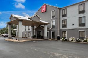 a hotel with a parking lot in front of it at Red Roof Inn & Suites Bloomsburg - Mifflinville in Mifflinville