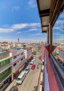 a view of a city with cars on a street at First Inn Hotel & Business in Texcoco de Mora