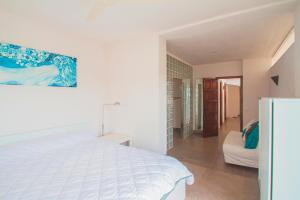 Postel nebo postele na pokoji v ubytování Club Villamar - Monnee