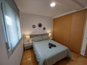 Giường trong phòng chung tại ARODRI SELLA